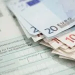 Swiss tax form covered with euros