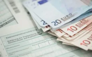 Swiss tax form covered with euros