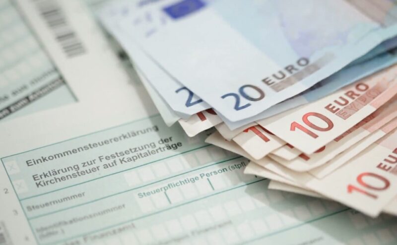 Swiss tax form covered with euros