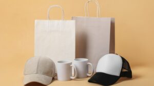 Gift bags, mugs, and caps displayed together as simple merchandise ideas for small events and conventions