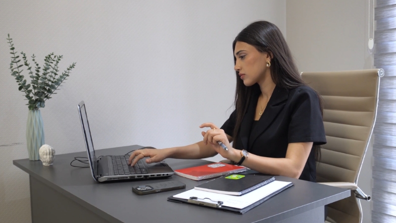 Founder working on a laptop while planning vision and culture before hiring a startup team