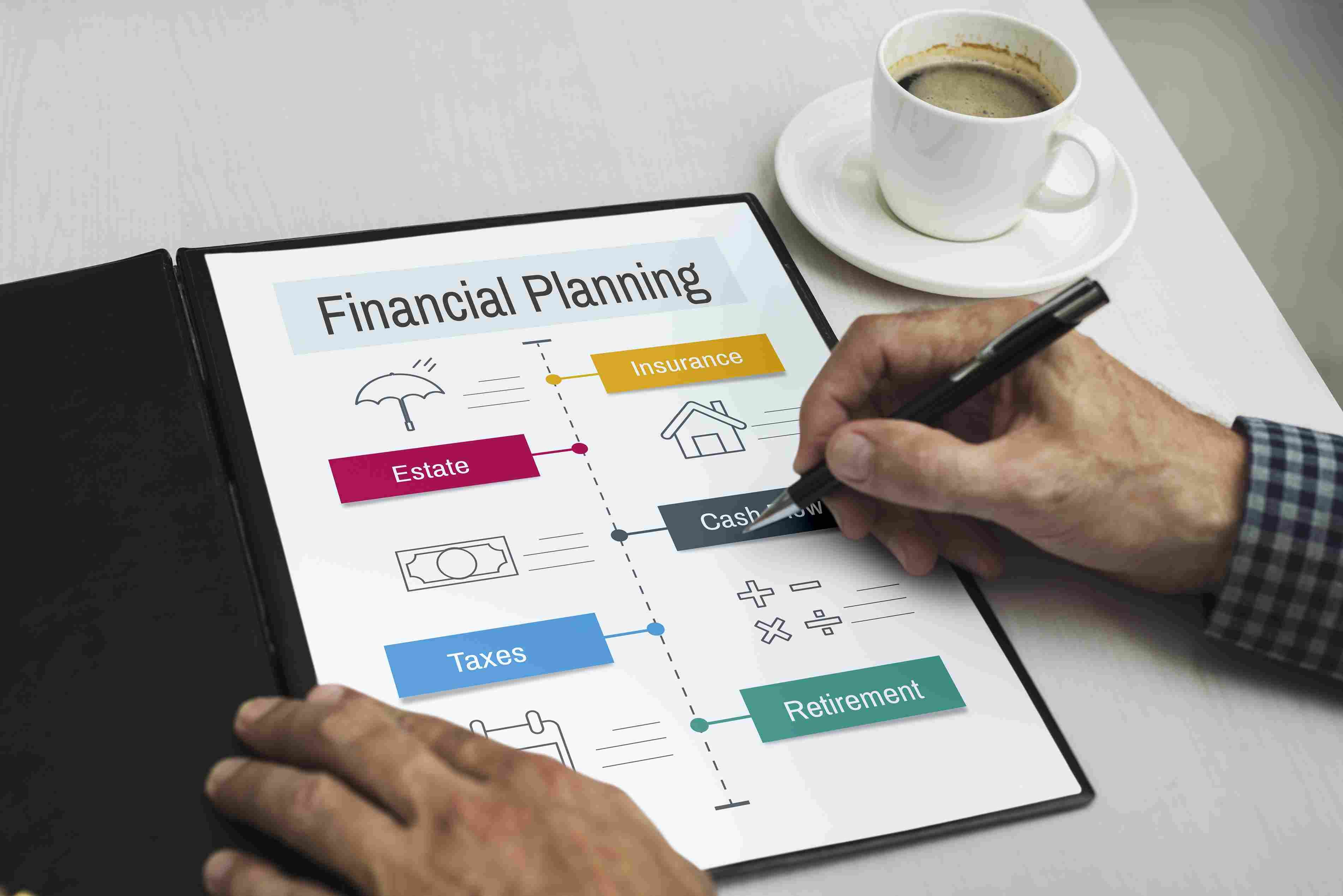 Person reviewing a financial planning document with notes about taxes, insurance, cash flow, and retirement