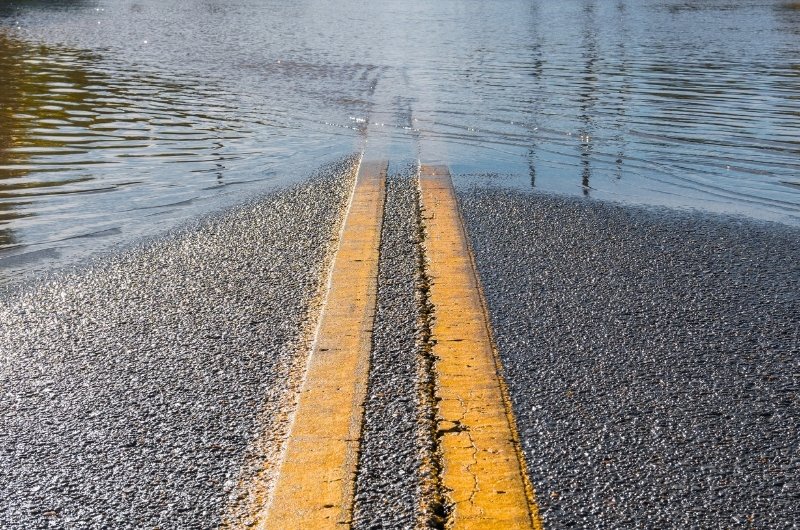 Flooded roadway in a designated flood-prone area.