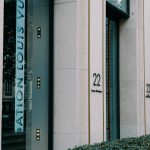 Sleek exterior of a modern luxury store with large windows and minimal design