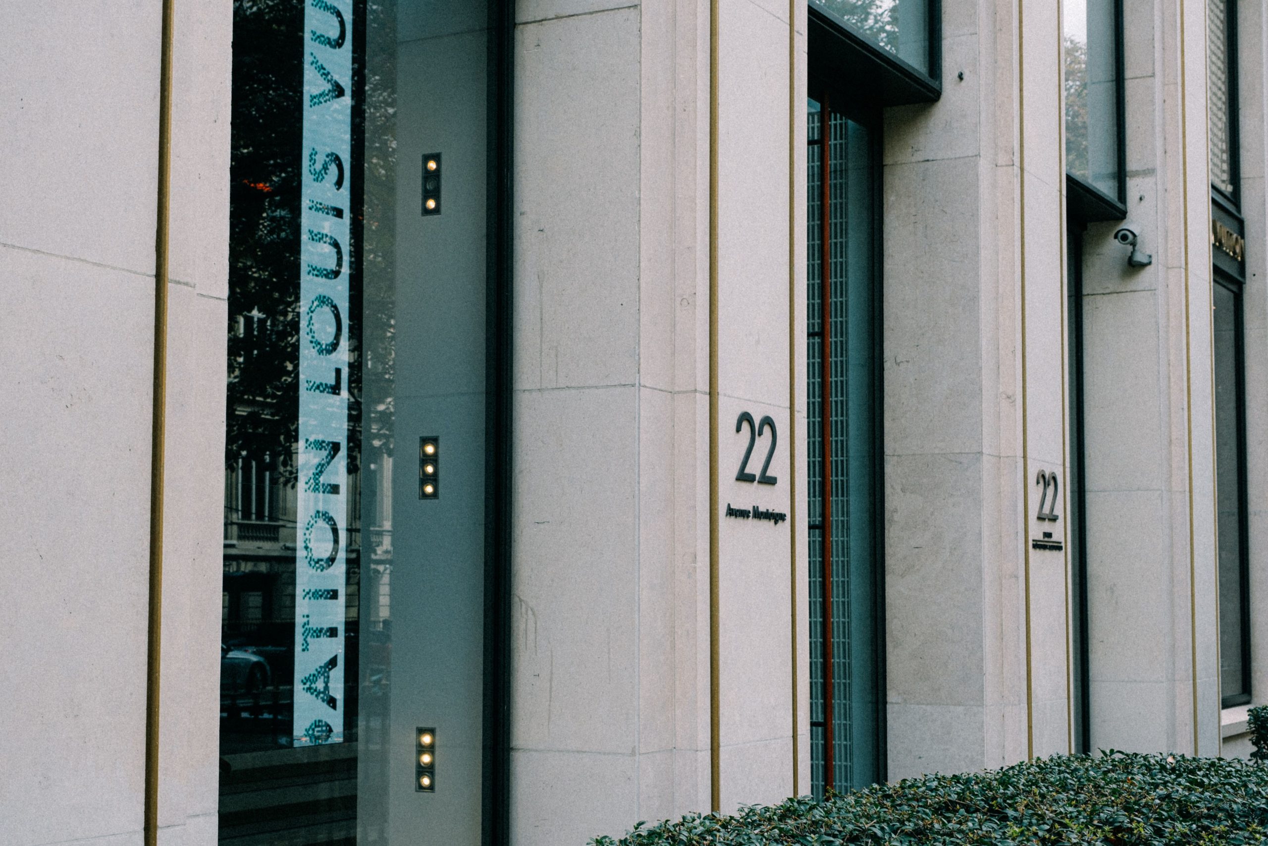 Sleek exterior of a modern luxury store with large windows and minimal design